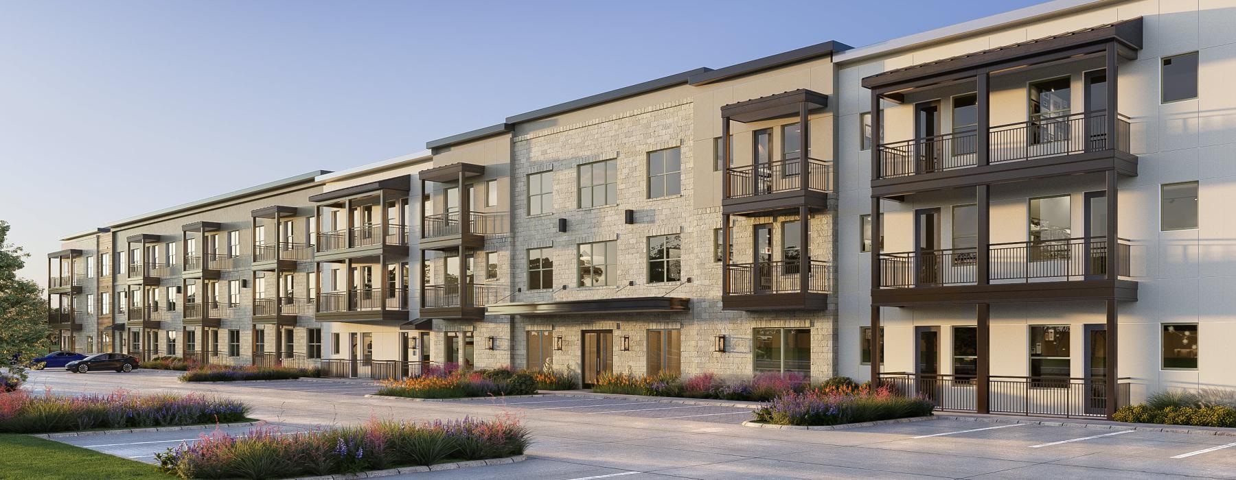 a large building with many windows and parking lot